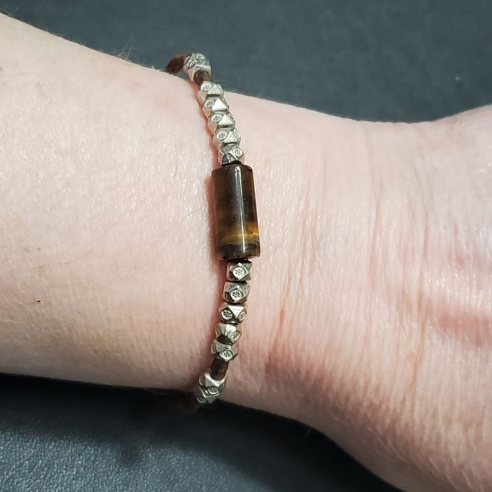 Adjustable corded bracelet with tigers eye stone